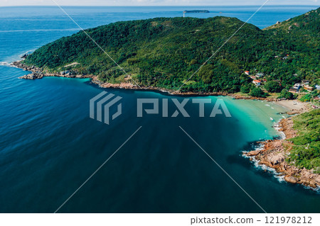 Above view of coastline with beach, mountains and ocean in Brazil. Aerial view of Barra da lagoa in Floripa 121978212