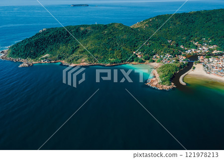 Above view of coastline with beach, mountains and ocean in Brazil. Aerial view of Barra da lagoa in Florianopolis 121978213