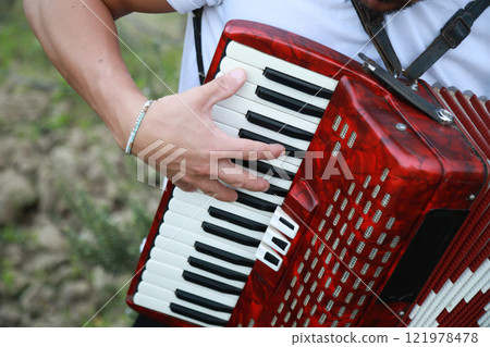 Technique And Ability Of A Professional Accordion Player  121978478