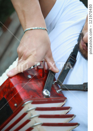 Closing An Accordion At The End Of A Performance  121978480