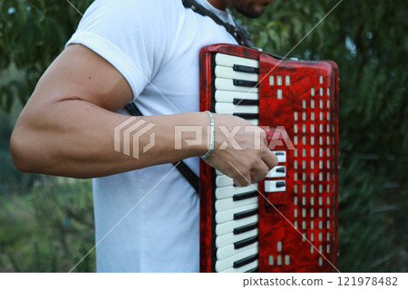 Technique And Ability Of A Professional Accordion Player  121978482
