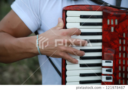 Technique And Ability Of A Professional Accordion Player Technique And Ability Of A Professional Accordion Player 121978487