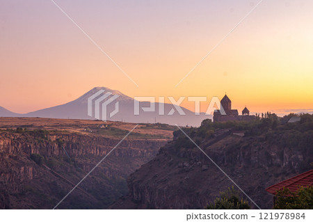 Beautiful View of Ararat and Hovhannavank monastery. Medieval church and Kasakh gorge and river canyon on evening autumn sunset. Aragatsotn Province, Armenia. Europe. Beautiful View of Ararat and Hovhannavank monastery. Medieval church and Kasakh gorge and river canyon on evening autumn sunset. Aragatsotn Province, Armenia. Europe. 121978984
