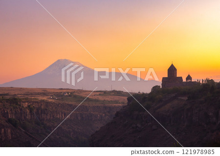 Beautiful View of Ararat and Hovhannavank monastery. Medieval church and Kasakh gorge and river canyon on evening autumn sunset. Aragatsotn Province, Armenia. Europe. Beautiful View of Ararat and Hovhannavank monastery. Medieval church and Kasakh gorge and river canyon on evening autumn sunset. Aragatsotn Province, Armenia. Europe. 121978985