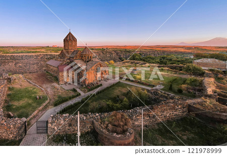 Aerial view of Hovhannavank monastery and Ohanavan village. Mount Ara, medieval church and Kasakh gorge and river canyon on sunny autumn sunset. Aragatsotn Province, Armenia. Europe. 121978999