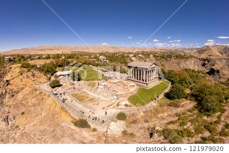 Aerial view of famous Garni pagan temple with Ionic-colonnaded. Historic Greek style building is located on gorge. Built in I century AD by Armenian king Trdat. Ancient Khosrov Reserve, Armenia Europe Aerial view of famous Garni pagan temple with Ionic-colonnaded. Historic Greek style building is located on gorge. Built in I century AD by Armenian king Trdat. Ancient Khosrov Reserve, Armenia Europe 121979020
