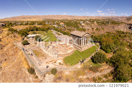Aerial view of famous Garni pagan temple with Ionic-colonnaded. Historic Greek style building is located on gorge. Built in I century AD by Armenian king Trdat. Ancient Khosrov Reserve, Armenia Europe Aerial view of famous Garni pagan temple with Ionic-colonnaded. Historic Greek style building is located on gorge. Built in I century AD by Armenian king Trdat. Ancient Khosrov Reserve, Armenia Europe 121979021