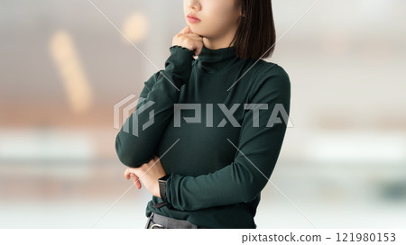 A young woman/businesswoman thinking 121980153