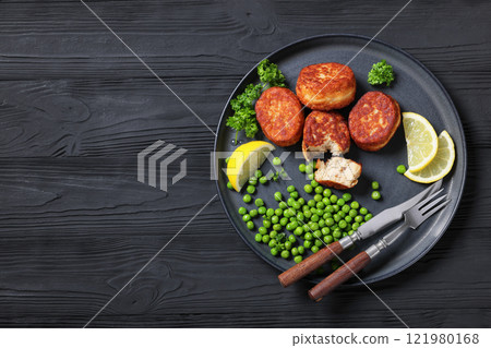 Danish atlantic cod fish cakes with green peas 121980168