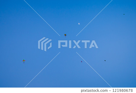 Kids Flying Kites Under a Clear Sky Peaceful and Joyful Outdoor Scene. High quality photo 121980678