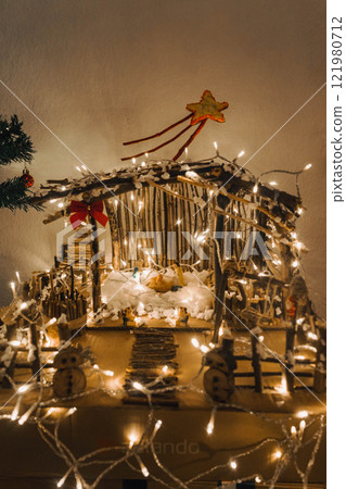 Handmade Wooden Christmas Nativity Scene with Lights and Pine Tree Festive Holiday Decor and Warm Wishes. High quality photo 121980712