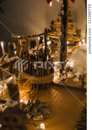 Handmade Wooden Christmas Nativity Scene with Lights and Pine Tree Festive Holiday Decor and Warm Wishes. High quality photo 121980719