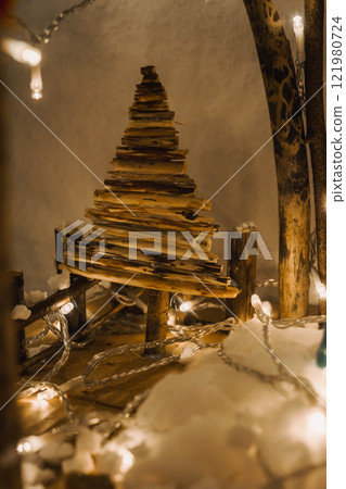 Handmade Wooden Christmas Nativity Scene with Lights and Pine Tree Festive Holiday Decor and Warm Wishes. High quality photo Handmade Wooden Christmas Nativity Scene with Lights and Pine Tree Festive Holiday Decor and Warm Wishes. High quality photo 121980724