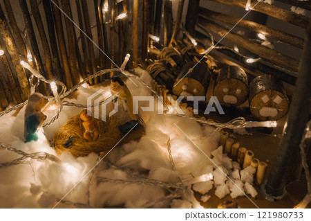 Handmade Wooden Christmas Nativity Scene with Lights and Pine Tree Festive Holiday Decor and Warm Wishes. High quality photo Handmade Wooden Christmas Nativity Scene with Lights and Pine Tree Festive Holiday Decor and Warm Wishes. High quality photo 121980733