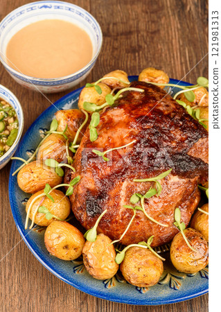 Freshly baked potatoes and meat strewn with green sprouts. Freshly baked potatoes and meat strewn with green sprouts. 121981313