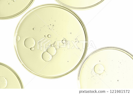 The texture of a cosmetic serum or body gel in a Petri dish. 121981572