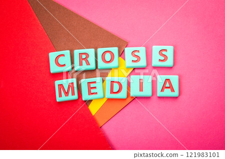 CROSS MEDIA. Alphabet letter tiles on a red textured background CROSS MEDIA. Alphabet letter tiles on a red textured background 121983101