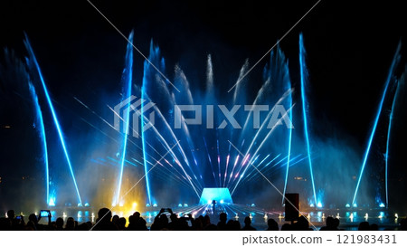 Impressive Performance Of Dancing Fountain With Blue Water Jets At Night Impressive Performance Of Dancing Fountain With Blue Water Jets At Night 121983431