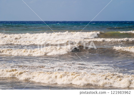 Waves crashing on the shore of turbulent sea Waves crashing on the shore of turbulent sea 121983962