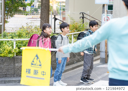 Elementary school students going to and from school 121984972