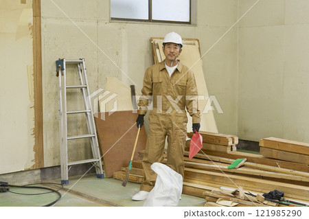 Man in work clothes, demolition site, portrait, looking at camera Man in work clothes, demolition site, portrait, looking at camera 121985290
