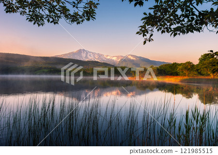 Mt. Chokai in the early morning and its reflection on the lake 121985515