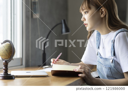 A woman heading to a desk A woman heading to a desk 121986000