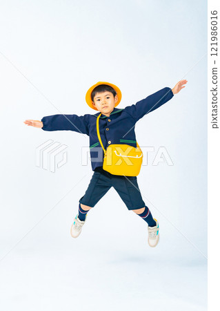 Kindergarten/nursery school boy jumping 121986016