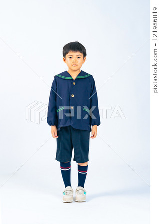 Full-body photo of a boy wearing children's clothing Full-body photo of a boy wearing children's clothing 121986019