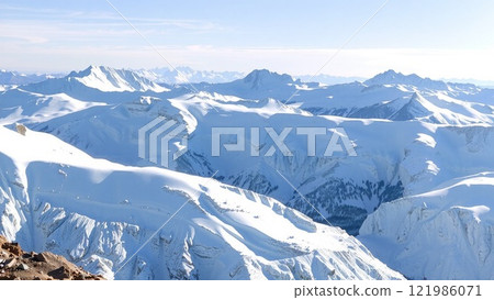 Snowy mountains stretching into the distance 121986071