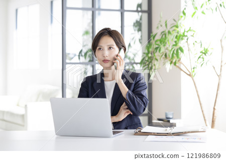 Business: Businesswoman working 121986809