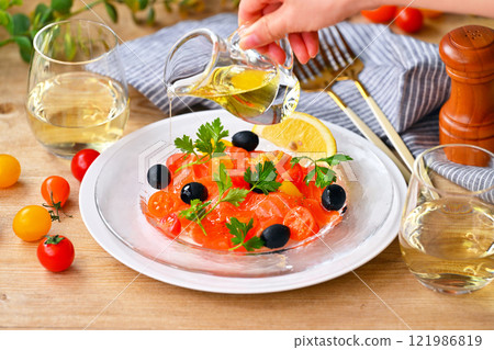 Salmon carpaccio, carpaccio salad, salmon and cherry tomato carpaccio, Italian 121986819