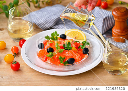 Salmon carpaccio, carpaccio salad, salmon and cherry tomato carpaccio, Italian Salmon carpaccio, carpaccio salad, salmon and cherry tomato carpaccio, Italian 121986820