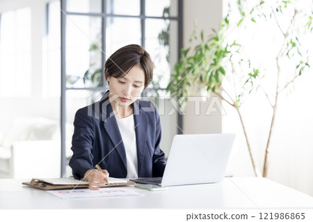 Business: Businesswoman working 121986865