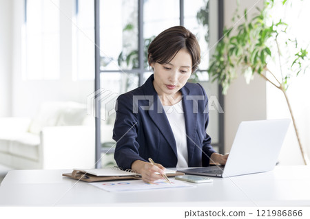 Business: Businesswoman working 121986866