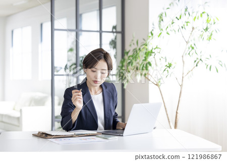 Business: Businesswoman working 121986867