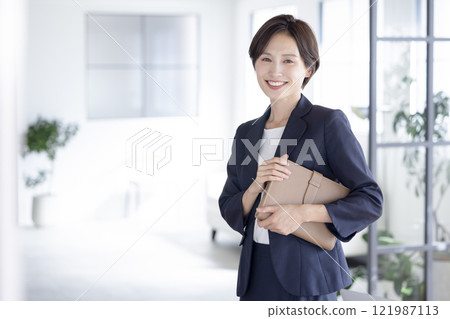 Portrait of a woman in a business suit Portrait of a woman in a business suit 121987113