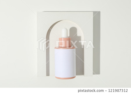 Cosmetic oil in a bottle with a decorative arch Cosmetic oil in a bottle with a decorative arch 121987312