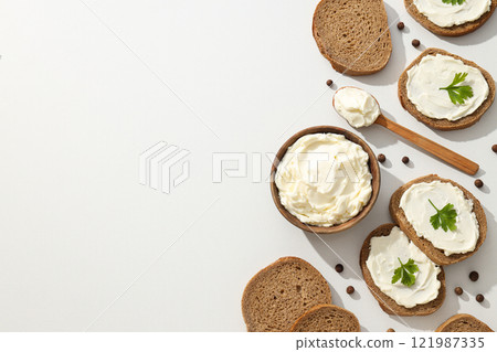 Sandwiches with Philadelphia cheese on a light background. Sandwiches with Philadelphia cheese on a light background. 121987335