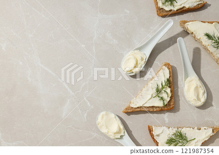 Sandwiches with Philadelphia cheese on a light background. 121987354