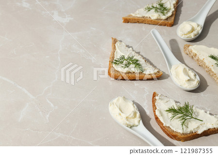 Sandwiches with Philadelphia cheese on a light background. 121987355
