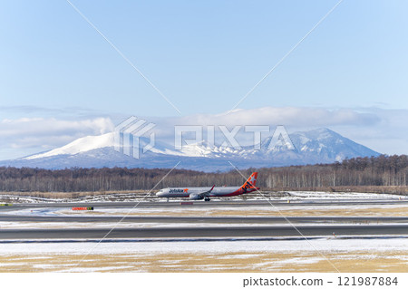 Planes at New Chitose Airport in winter, Mount Tarumae and Mount Fusubushi, Chitose, Hokkaido Planes at New Chitose Airport in winter, Mount Tarumae and Mount Fusubushi, Chitose, Hokkaido 121987884