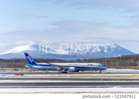 Planes at New Chitose Airport in winter, Mount Tarumae and Mount Fusubushi, Chitose, Hokkaido Planes at New Chitose Airport in winter, Mount Tarumae and Mount Fusubushi, Chitose, Hokkaido 121987911