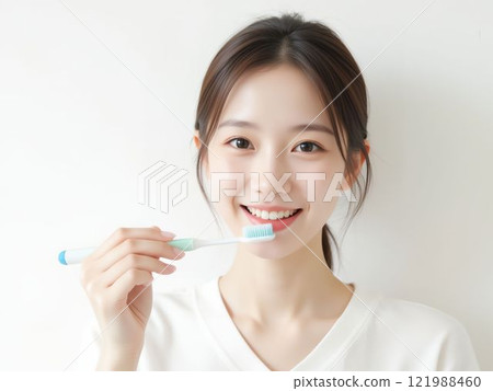 Japanese woman brushing her teeth 121988460