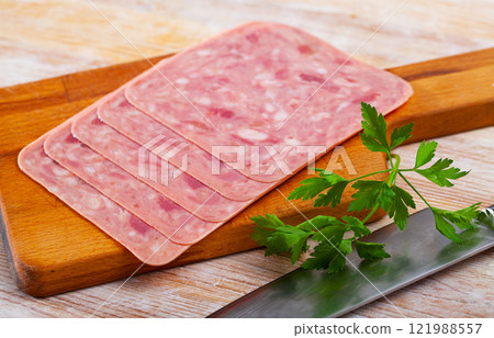 Sliced ham on wooden background Sliced ham on wooden background 121988557