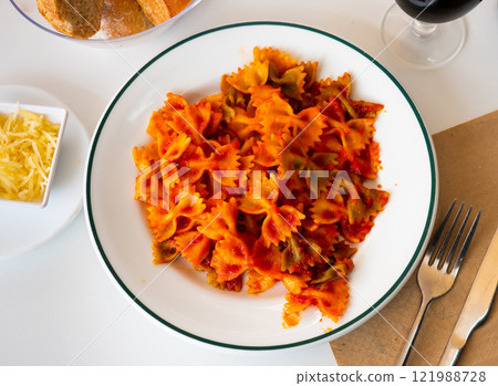 Lazos con tomate, spanish pasta in tomato sauce Lazos con tomate, spanish pasta in tomato sauce 121988728