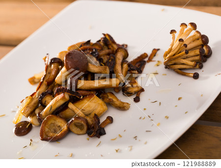 Fried wood mushrooms 121988889
