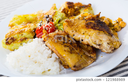 Fried chicken thighs with garnish 121988989
