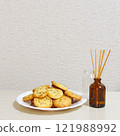 Tea cookies and room fragrance on a plate 121988992