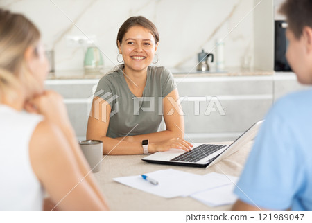 Girl manager tells clients about specifics of design of microloan, about benefits and advantages Girl manager tells clients about specifics of design of microloan, about benefits and advantages 121989047